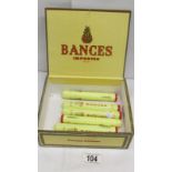 A Corona Deluxe cigar box and 6 'Banges' Corona Deluxe cigars