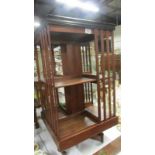 An Edwardian mahogany revolving book case