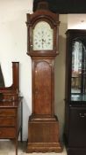 A 19th century oak long cased clock. J.