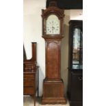 A 19th century oak long cased clock. J.