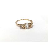 A 14ct yellow gold ring set white sapphires,