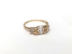 A 14ct yellow gold ring set white sapphires,