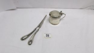 A silver condiment pot with inscription and blue glass liner, hall marked Birmingham 1910/11,