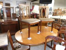 A teak dining table & 4 chairs