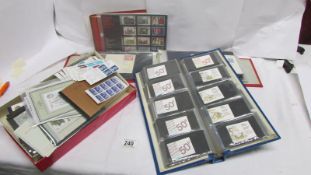 A quantity of British stamps in 3 folders and a box including commemorative and booklets