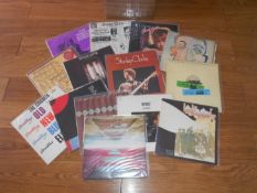 A box of approcimately 60 rock and folk jazz LP records including Stanley Clark, Beatles, Bob Dylan,