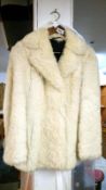 A white fur fabric jacket