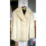 A white fur fabric jacket