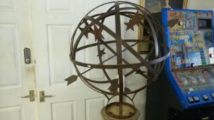 A super steel armillary globe on a reeded church stone column