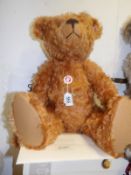 A boxed Steiff teddy bear, red brown,