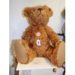 A boxed Steiff teddy bear, red brown,