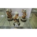 3 figurines of child musicians