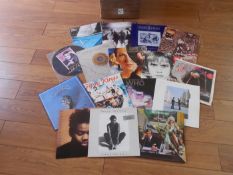 A box of approximately 80 rock LP records including Pink Floyd, Tracy Chapman, The Who, U2,