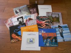 A box of approximately 60 rock and pop LP records including Led Zeppelin, Simon and Garfunkle,