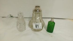 2 silver necked perfume bottles and one other