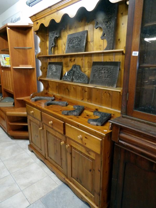 A collection of early carved wood panels and brackets