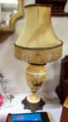 A Victorian hand painted table lamp with metal base & silk shade