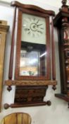 An Edwardian inlaid wall clock by Gadsby,