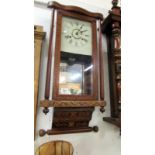 An Edwardian inlaid wall clock by Gadsby,