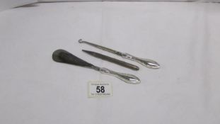 A silver handled shoehorn,