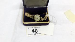 A ladies Kaiser wristwatch with 9ct gold strap