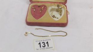 A mixed lot of 9ct gold including earrings, crosses,