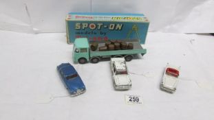 3 unboxed Triang Spot-on models and a boxed ERF flat float with barrel load