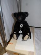 A boxed Steiff 1908 black teddy bear,