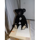 A boxed Steiff 1908 black teddy bear,