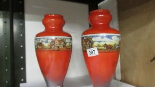 A pair of 1930's Kew vases with coaching scenes