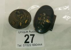 A Samurai button and a buckle piece