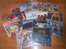 A box of approximately 60 thrash and heavy metal rock LP records including Iron Maiden, Halloween,