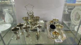 A mixed lot of silver plate egg cups on stands etc