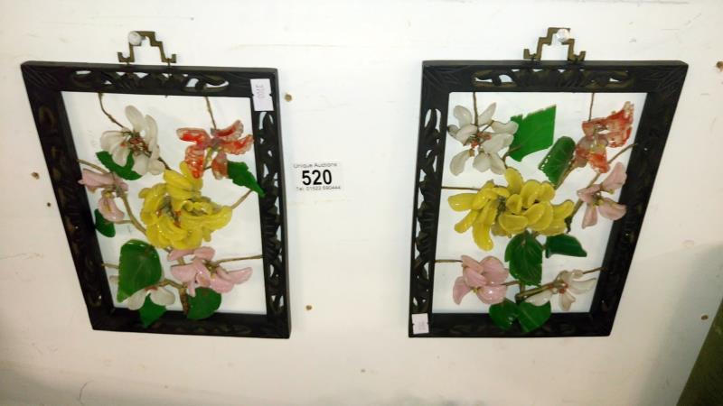 A pair of metal framed floral collages