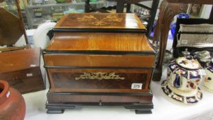 A 20th century continental style drinks cabinet with 4 decanters and 14 glasses