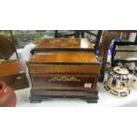 A 20th century continental style drinks cabinet with 4 decanters and 14 glasses