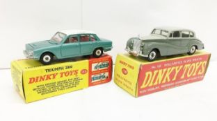 A boxed Dinky 150 Rolls Royce Silver Wraith and a boxed Dinky 135 Triumph 2000 car