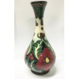 A boxed Moorcroft ruby vase signed by Rachel Bishop