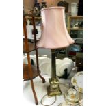 A brass Corinthian column table lamp with shade