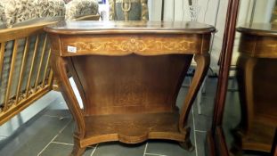 A mahogany inlaid console table