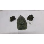 A Chinese bronze Buddhist face and 2 small bronze rabbits
