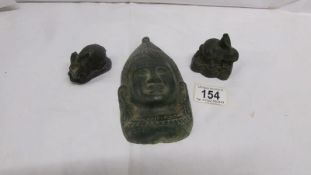 A Chinese bronze Buddhist face and 2 small bronze rabbits