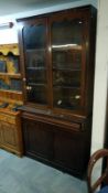 A Victorian mahogany glazed top book case