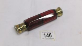 A Victorian double ended ruby glass scent bottle