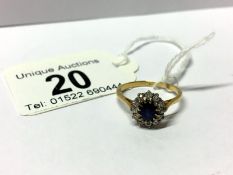 A gold ring set sapphire and diamonds, marked 18ct,