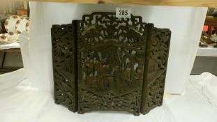 An intricately carved small oriental 3 fold screen