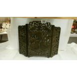 An intricately carved small oriental 3 fold screen