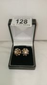 A pair of multi coloured gem earrings in gold, citrine,