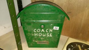 A green painted metal wall mounting letter box (no key)