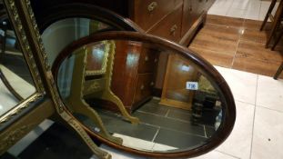 2 oval framed bevel edged mirrors